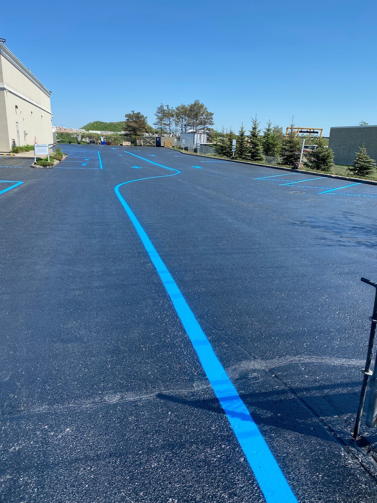 Blue restricted route pavement marking completed by Stratton’s