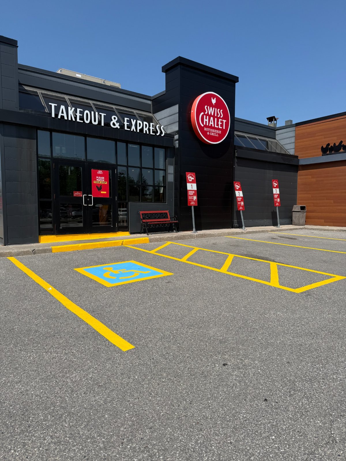 Commercial accessible parking space with blue cross-hatched access aisle